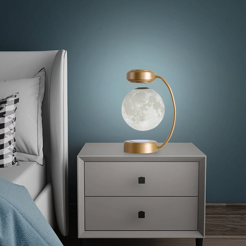 La Lune in gold on a nightstand