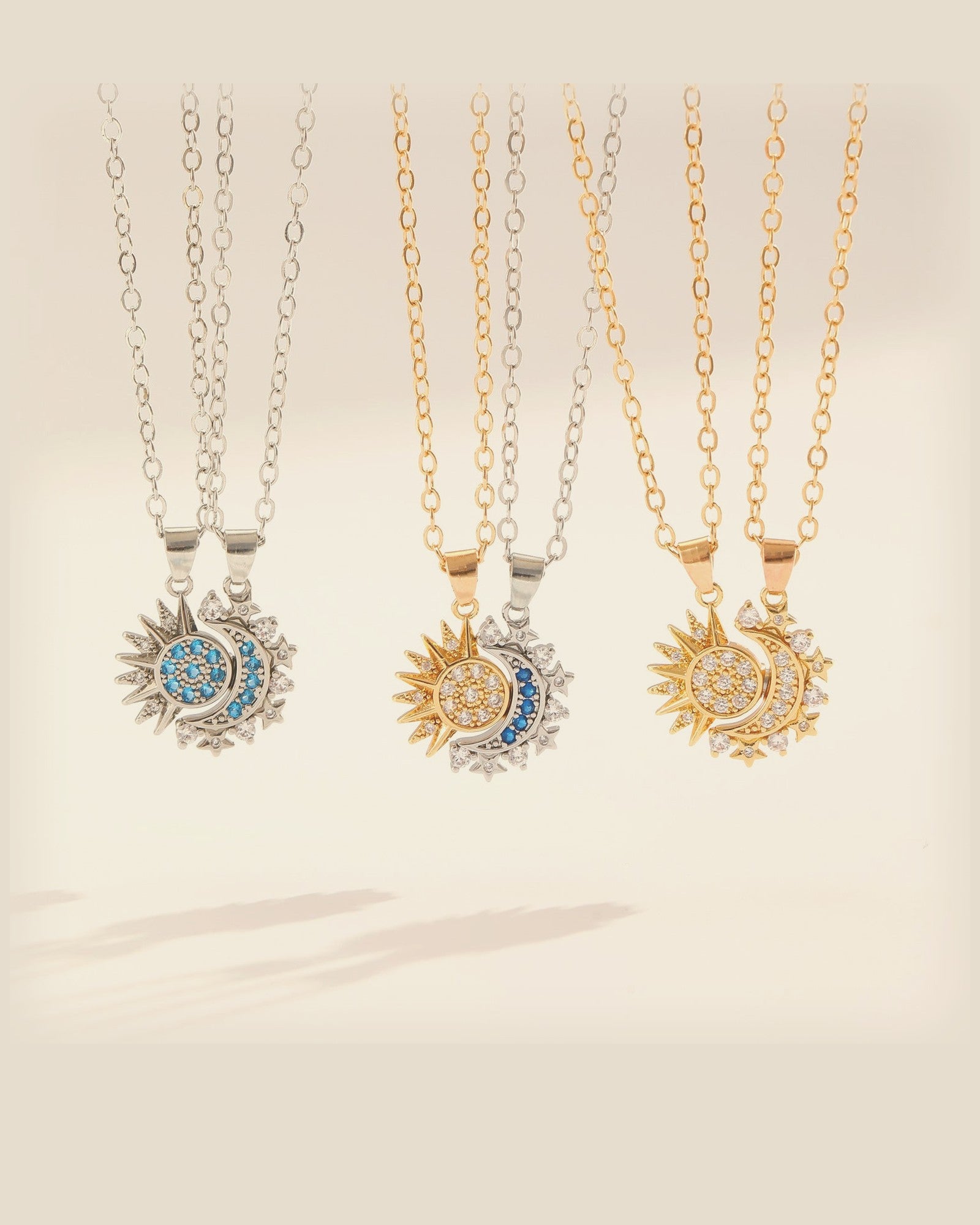 Éclipse magnetic sun and moon couple necklaces in gold, silver and two-tone on cream