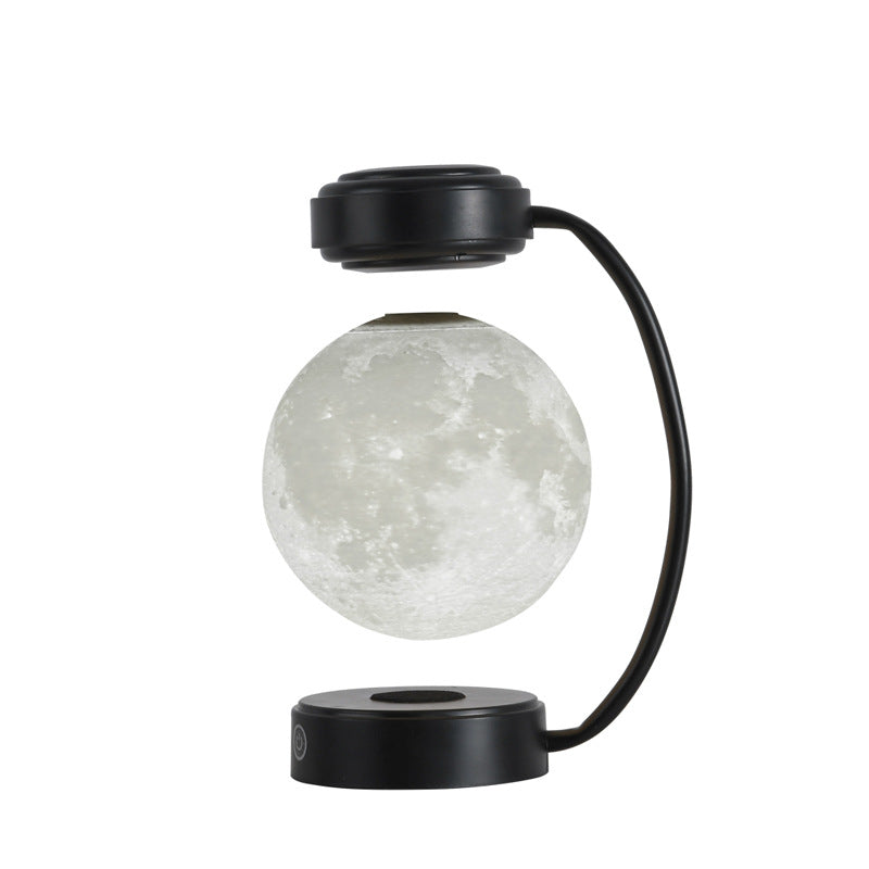 Levitating moon lamp, black frame, studio view