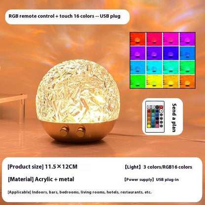 La Marée lamp lit in warm gold, with remote control and feature overview