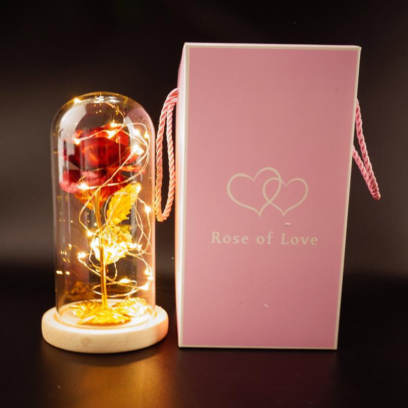 Red eternal rose in glass with the gift box