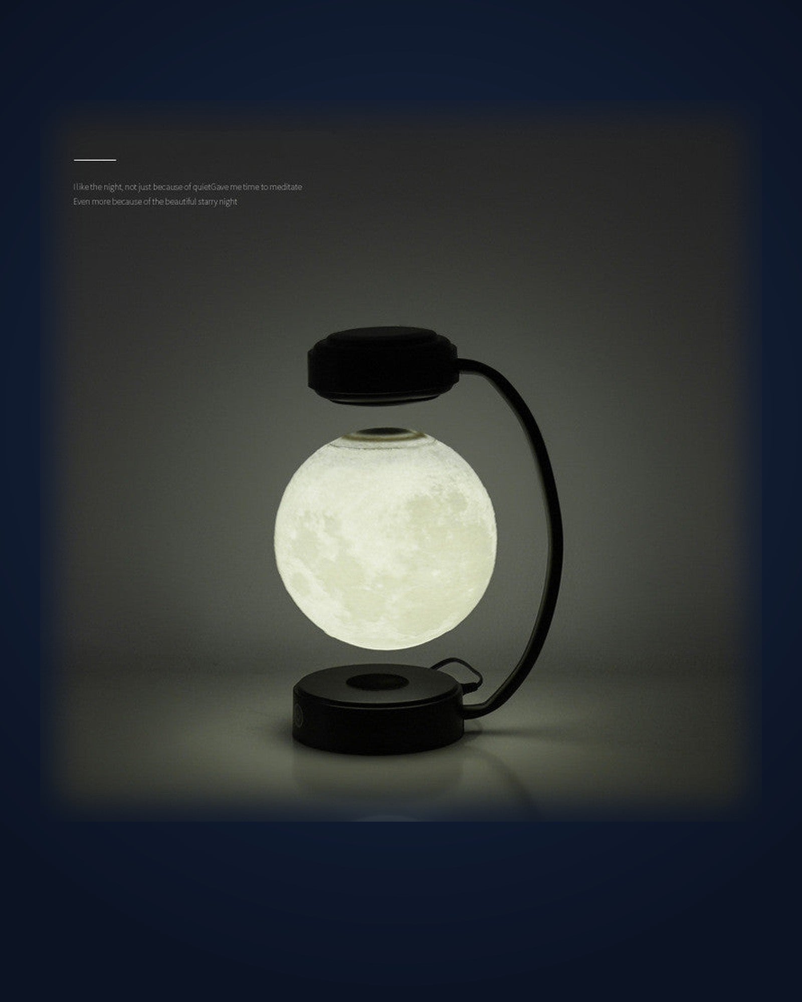 La Lune levitating moon lamp glowing on navy