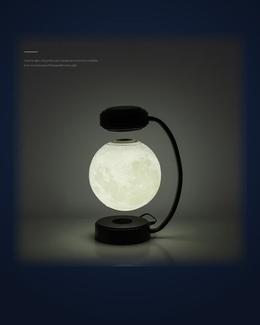 La Lune levitating moon lamp glowing on navy