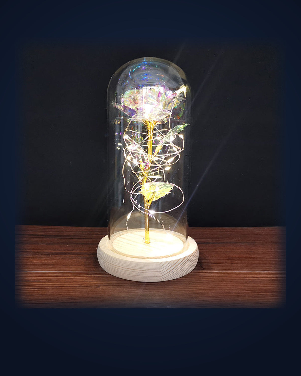 La Rose Éternelle glowing under its glass dome on navy