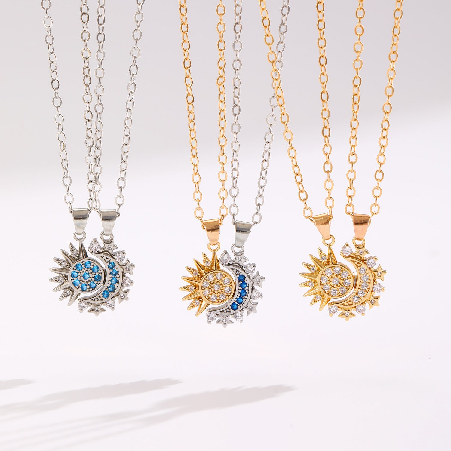 All three Éclipse variants: gold, silver and two-tone pendant pairs